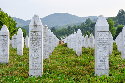 Srebrenica, Bosnia and Herzegovina - JULY 9, 2017: Potocari, Srebrenica memorial and cemetery for the victims of the genocide, memorial of Srebrenica massacre in Bosnia and Herzegovina with gravestones in the background