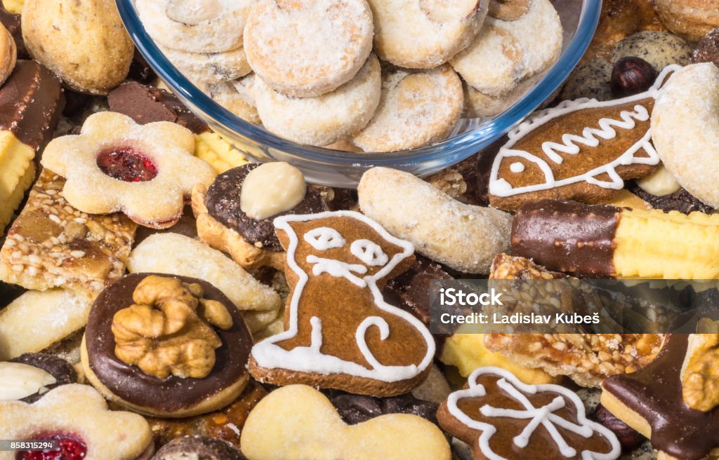 Close-up of traditional homemade Christmas cookies Sweet circles in glass bowl in heap of decorative pastries Advent Stock Photo