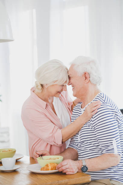 istock Couple of elders enjoy morning breakfast 858315806