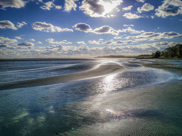 istock Low Tide at the Beach on a Cloudy, Sunny Day 858322712