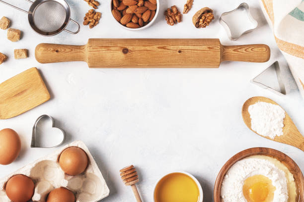 istock Ingredients for baking  - flour, wooden spoon, rolling pin, eggs. 858323590