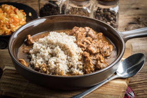 istock Barley groats with stewed meat. 858325798
