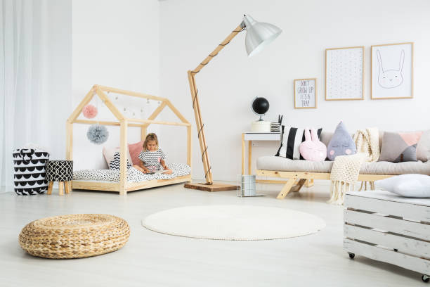 istock Girl sitting on handmade bed 858331530