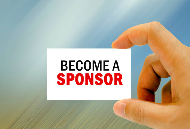 become a sponsor written on business card stock photo