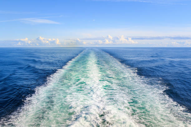 istock Trail on water surface behind the ferry 858337156
