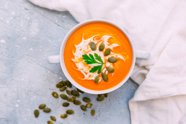 istock Pumpkin soup in white bowl topped 858337542