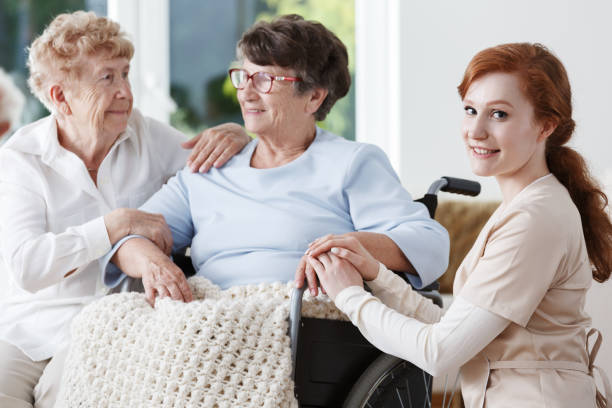 istock Young woman holding lady's hands 858341164