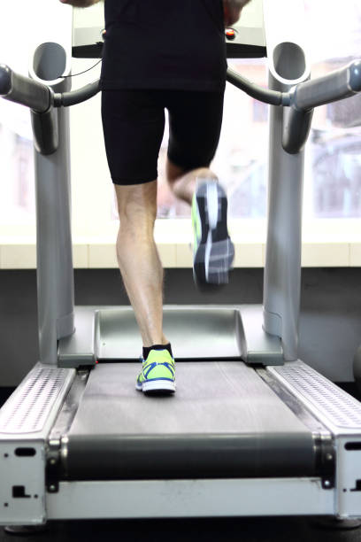 istock Athletic Runner Running on Treadmill in  Gym 858345850