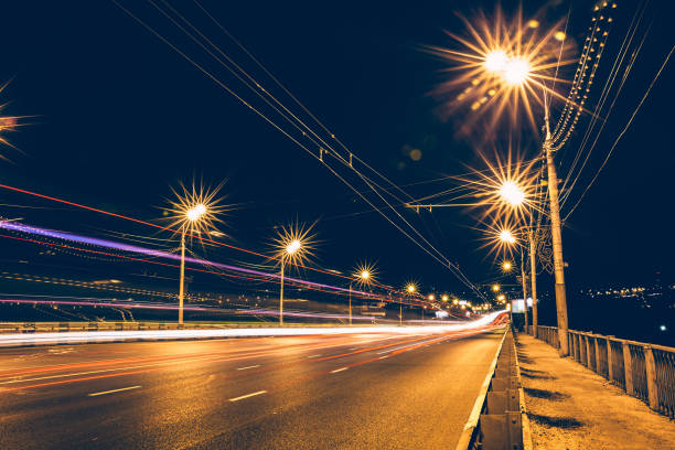 istock Traffic light trails on night urban road 858348246
