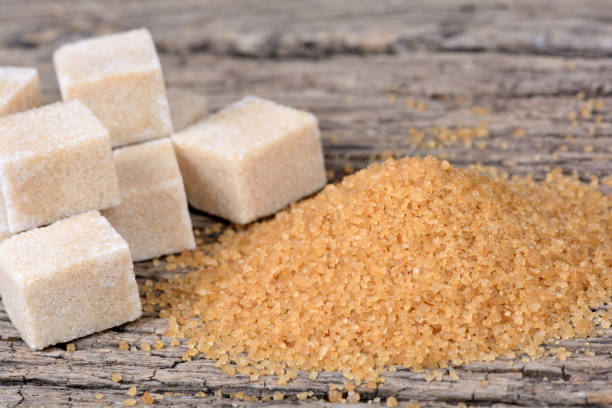 istock Beige sugar on wooden table 858348744
