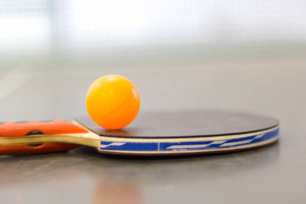 istock Racket and ball on table tennis table 858349446