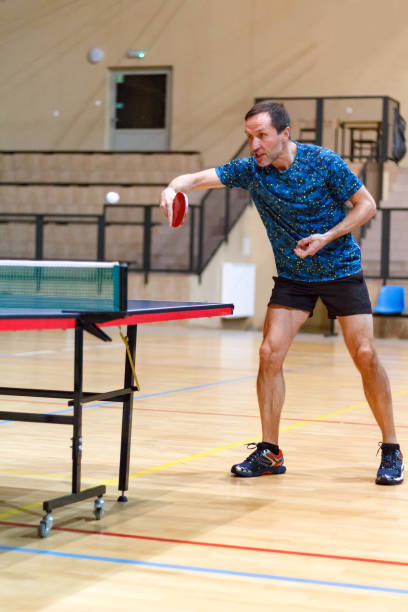 istock Male table tennis player playing backhand hit 858360450