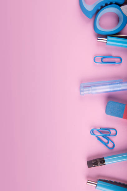 istock Blue and pink office. A lot of school objects on a pink background. 858377508