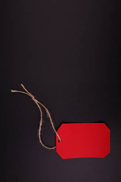 istock Bright red tag, on a black background. Black Friday. 858378304