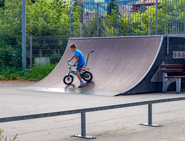 istock Boy riding bike in skate park 858388266