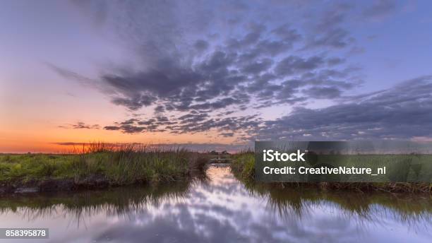 Sunset Over Waterway Split Stock Photo - Download Image Now - Surveyor, Water, Agricultural Field