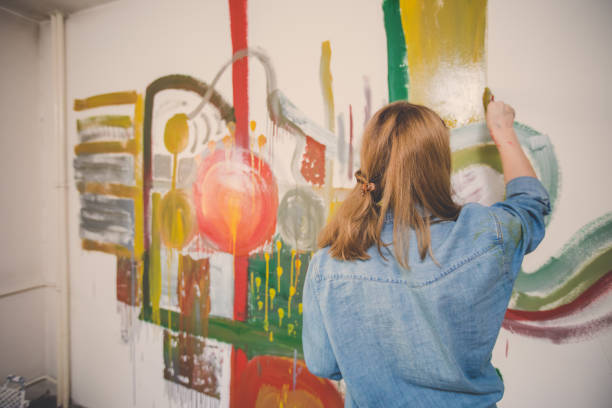 istock Woman painting alone 858396008