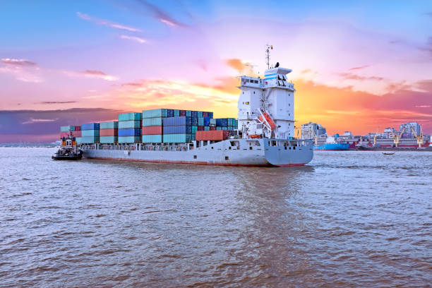 istock Containership on the Yangon river near Yangon in Myanmar at sunset 858402934