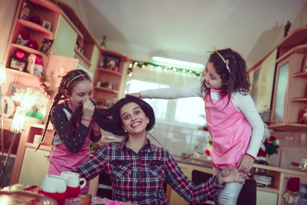 istock Mother Playing with Two Little Daughters at Home 858405492