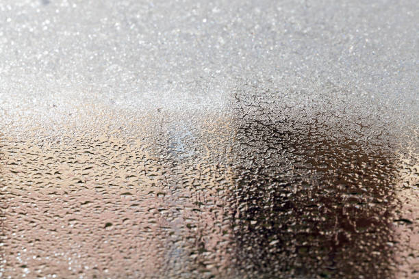 rime on the glass - snow driving side view mirror rain imagens e fotografias de stock