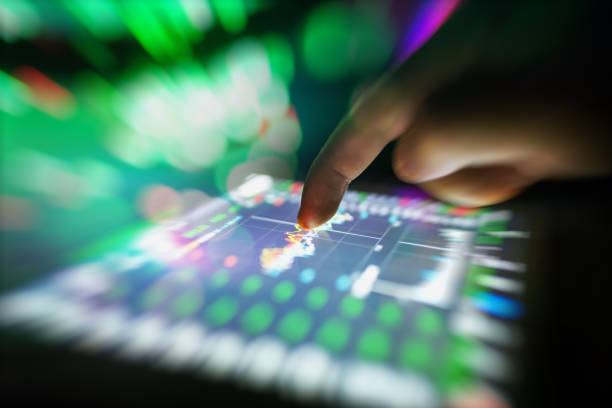 istock hand finger pointing to the touch pad with financial data 858420182
