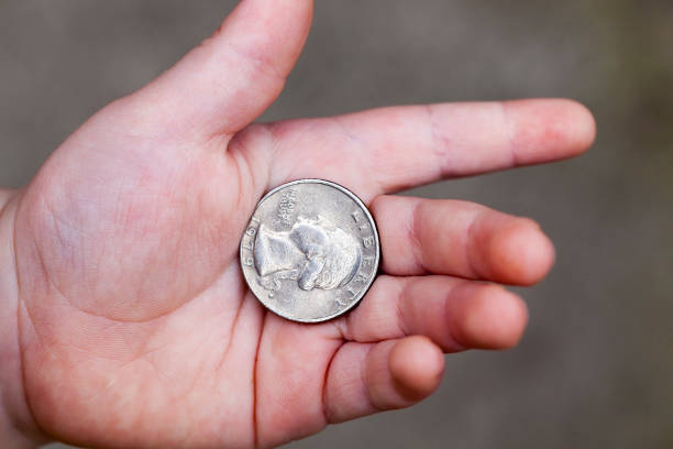 istock American coin in hand 858423690