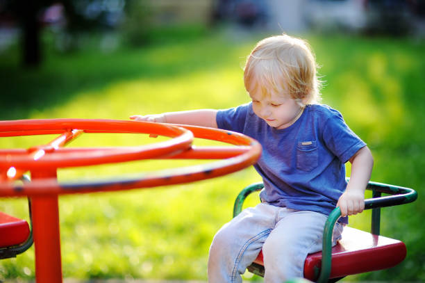 istock Toddler boy having fun on playground 858426252
