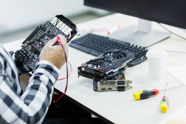 istock A professional man who repairs a graphics card. Cryptocurrency 858430348