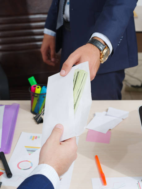 istock Transfer of money in an envelope in men 858432654