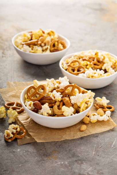 istock Homemade trail mix with popcorn, pretzels and nuts 858433210