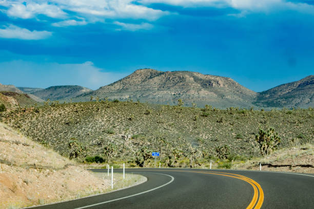 istock Curved Road towards the mountain 858436826