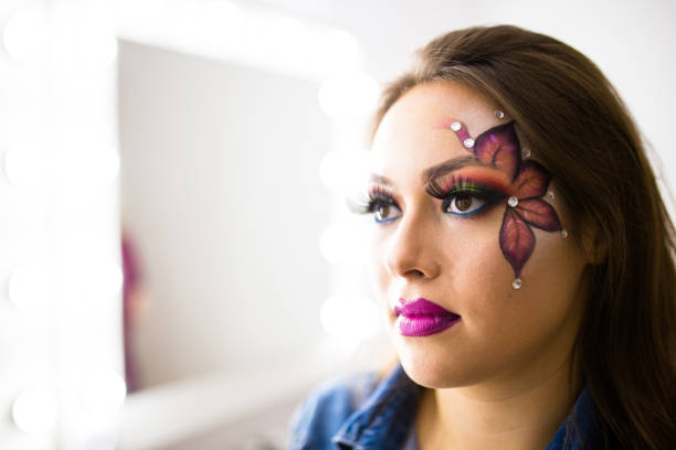 istock Beauty woman makeup with crystals on face 858437008