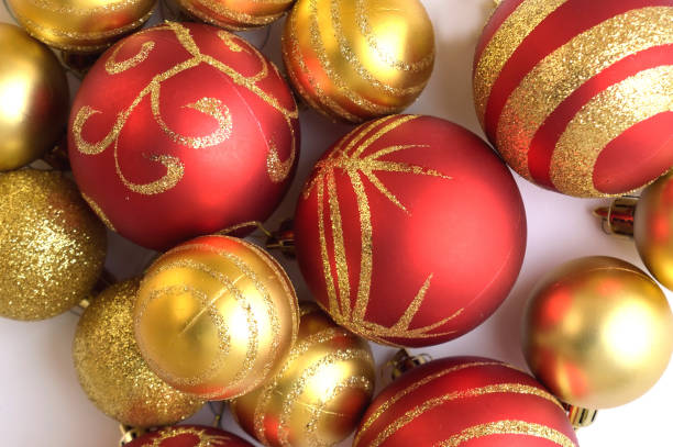 istock Top view of Christmas decoration (balls) on a white surface 858437240