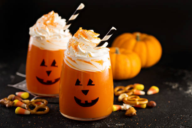 istock Halloween cold cocktail or drink with jack o'lantern face 858441868