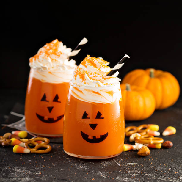 istock Halloween cold cocktail or drink with jack o'lantern face 858442106