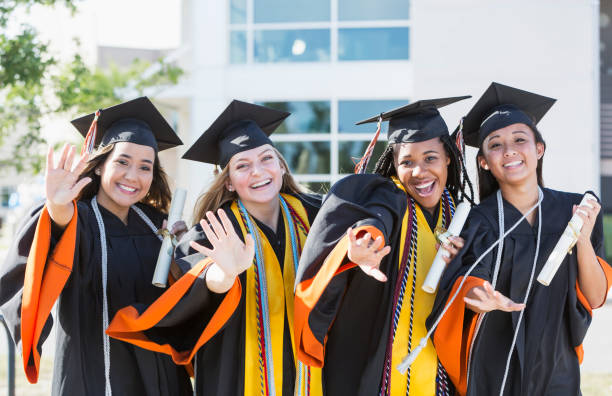 istock Four young women graduating from high school or college 858445964