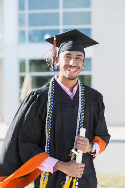 istock Young man graduating from high school or university 858446008