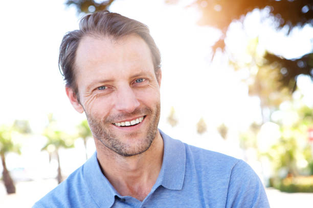 istock handsome middle age man smiling outdoors 858448866