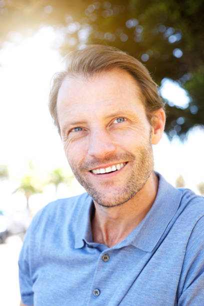 istock cool older guy smiling outdoors 858451834