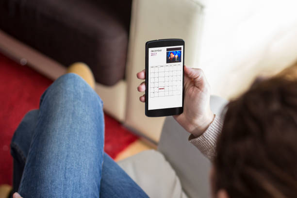 istock Woman using smart phone. Christmas calendar 858452136
