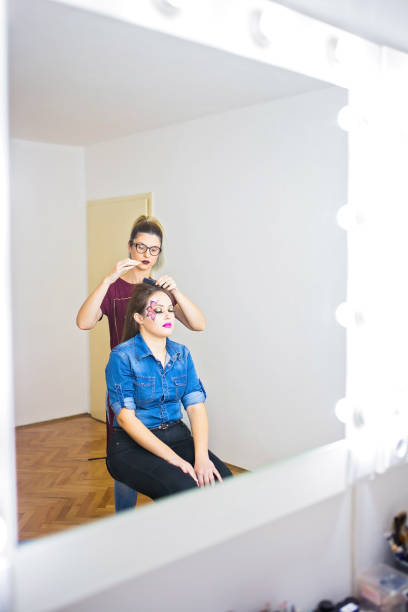istock Female make up artist working on model 858472444