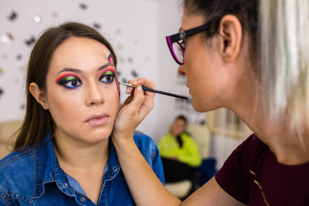 istock Makeup artist in the process of make-up 858472934
