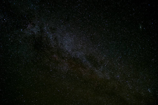 istock milky way galaxy, Long exposure photograph, with grain. 858473042