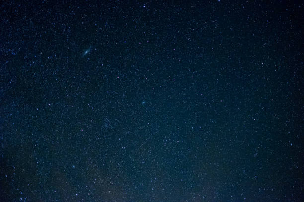 istock milky way galaxy, Long exposure photograph, with grain. 858475250