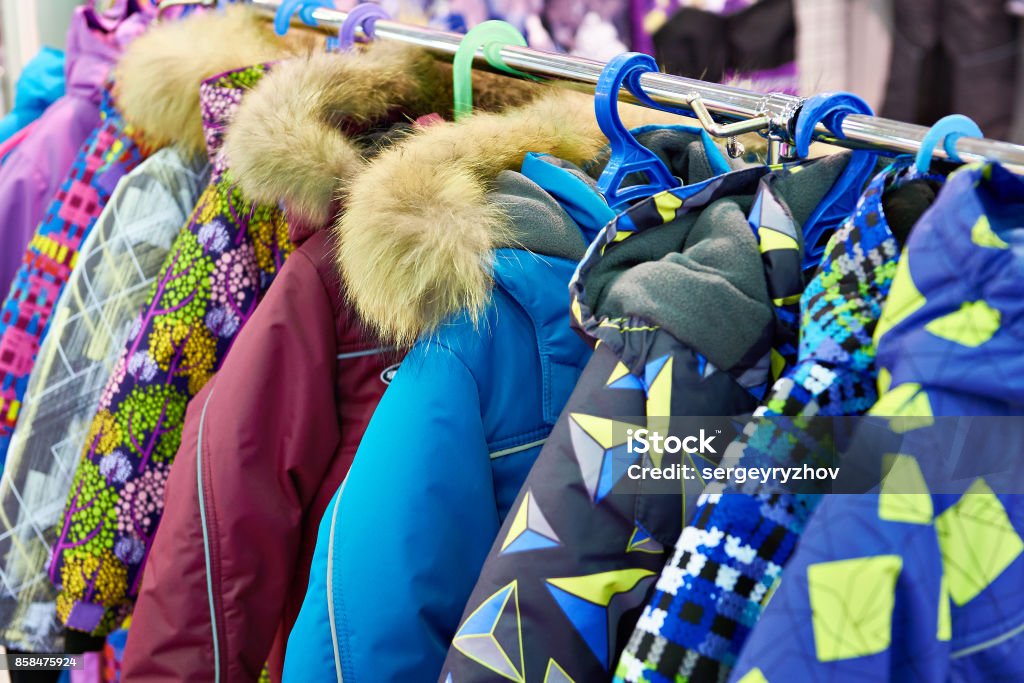 Children winter jackets on hanger in store Children winter jackets on a hanger in the store Coat - Garment Stock Photo