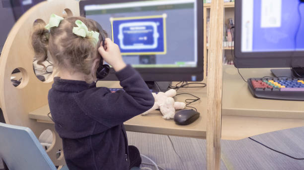 istock Little girl playing educational games on the computer. 858482596