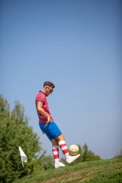 istock FootGolf Player Kicking Soccer Ball 858486430