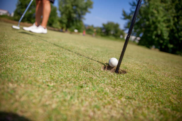 istock Golfer Putt Golf Ball on the Green 858486552