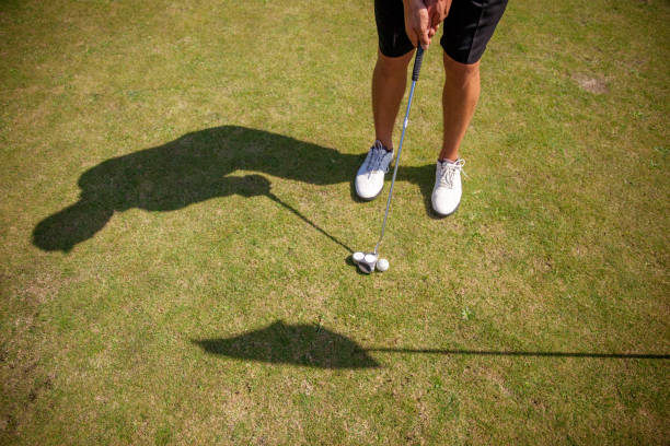 istock Golfer Putting Ball on the Green 858486570