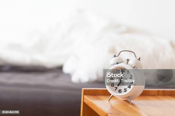 Good Morning With Alarm Clock On Bedside Table Stock Photo - Download Image Now - Alarm, Bed - Furniture, Bedroom